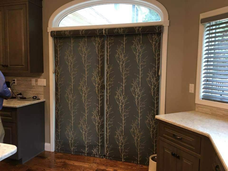 Transitional dark wood floor and brown floor kitchen photo with raised-panel cabinets, dark wood cabinets, granite countertops, beige backsplash and stone tile backsplash