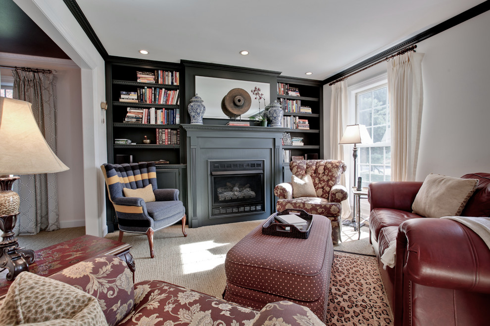 Small traditional enclosed living room in Chicago with a library, beige walls, carpet, a standard fireplace and no tv.