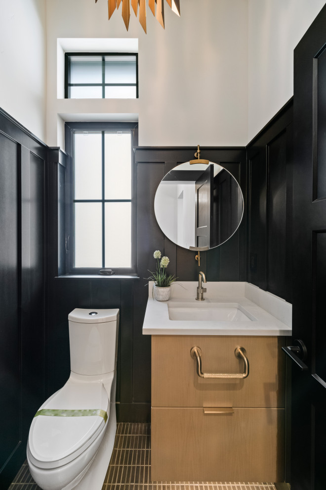 Inspiration for a mid-sized contemporary 3/4 bathroom in Other with flat-panel cabinets, light wood cabinets, a one-piece toilet, black walls, ceramic floors, an undermount sink, engineered quartz benchtops, black floor, white benchtops, a single vanity, a built-in vanity and panelled walls.