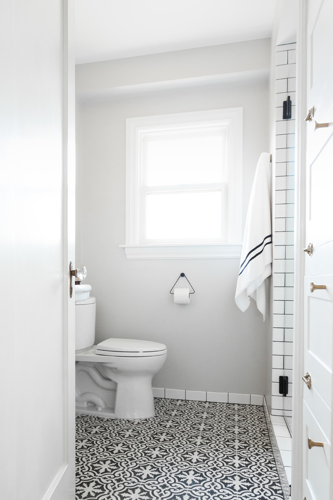 Photo of a mid-sized modern 3/4 bathroom in Seattle with an alcove shower, a two-piece toilet, white tile, subway tile, grey walls, cement tiles, a pedestal sink, multi-coloured floor and an open shower.