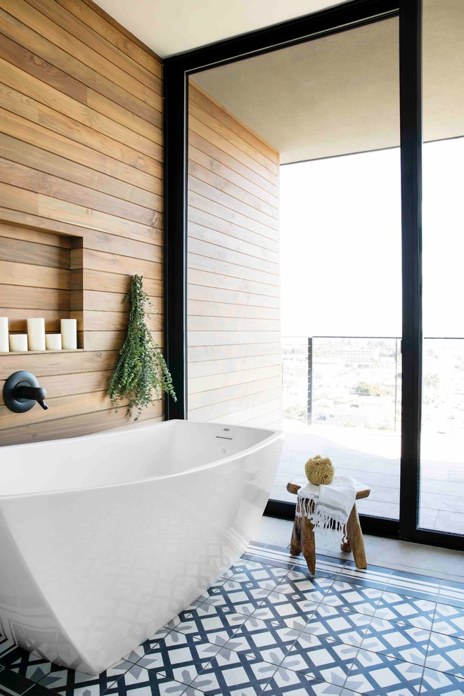 Inspiration for a transitional bathroom in San Diego with a freestanding tub, brown tile, brown walls and multi-coloured floor.