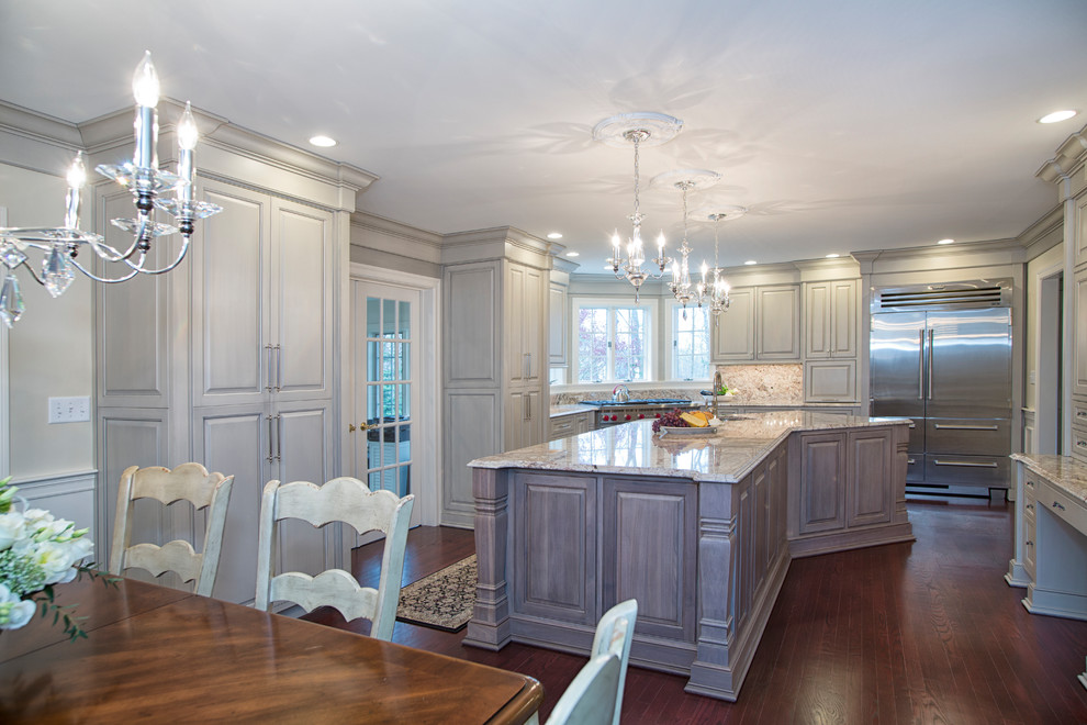 Inspiration for an expansive traditional u-shaped eat-in kitchen in Boston with a single-bowl sink, raised-panel cabinets, grey cabinets, granite benchtops, stone slab splashback, stainless steel appliances, dark hardwood floors, with island and red floor.