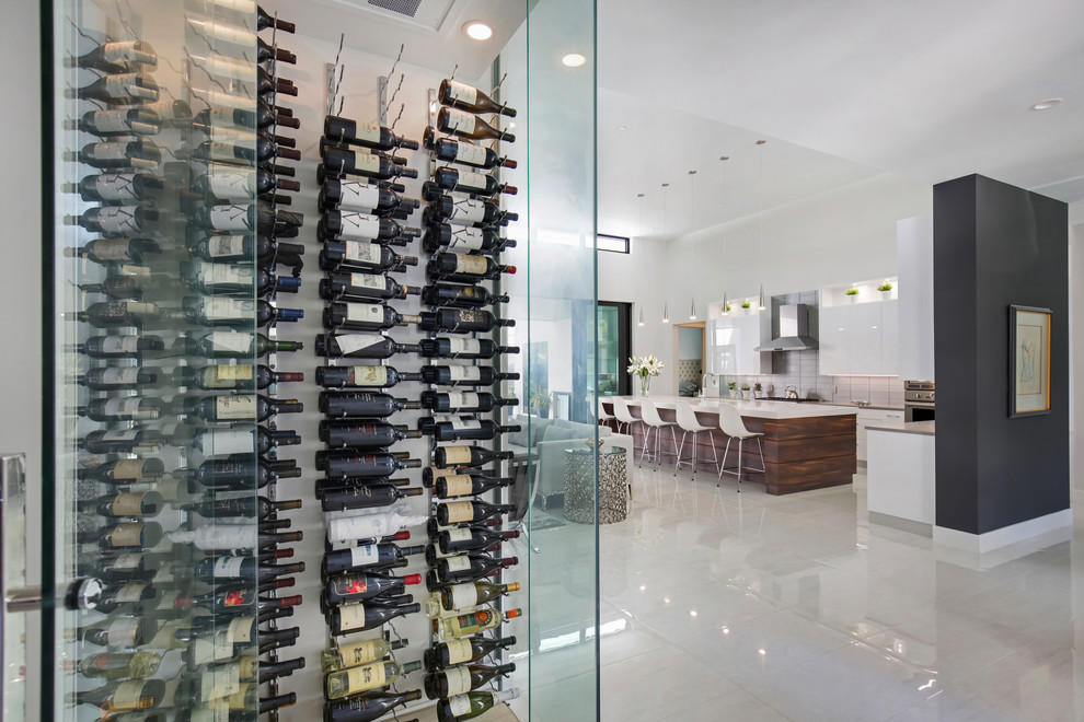 Design ideas for a mid-sized modern wine cellar in Tampa with porcelain floors and white floor.