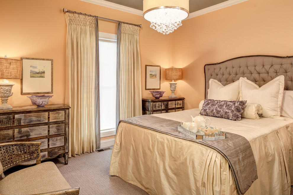 This is an example of a traditional bedroom in Louisville with beige walls and carpet.