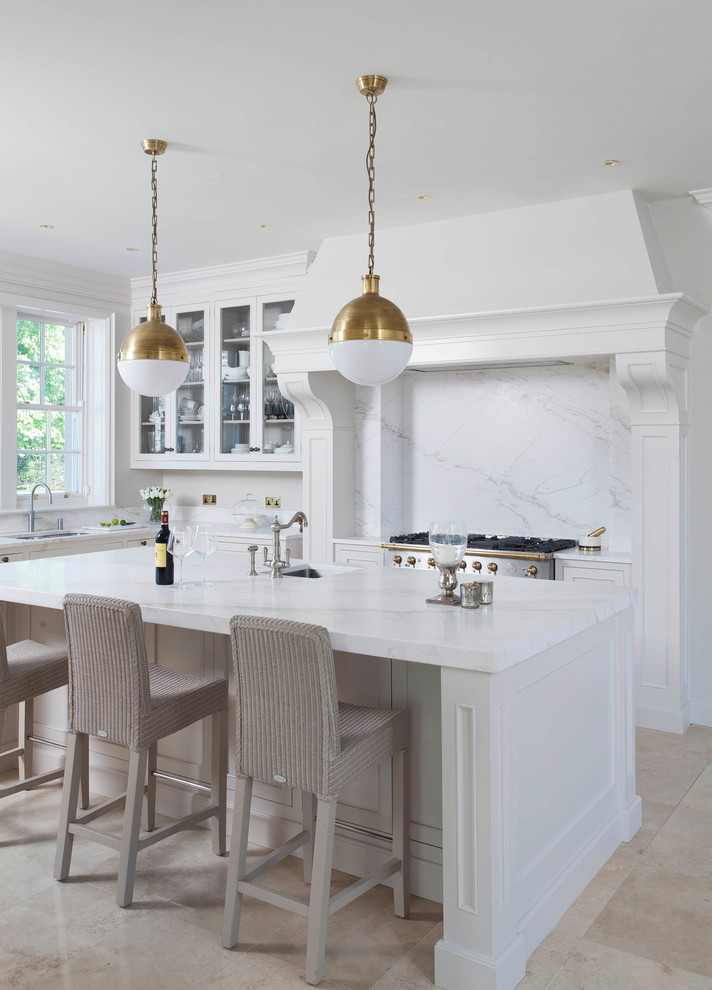 Design ideas for a large traditional u-shaped open plan kitchen in Other with a drop-in sink, beaded inset cabinets, white cabinets, marble benchtops, white splashback, marble splashback, stainless steel appliances, porcelain floors, with island, beige floor and yellow benchtop.