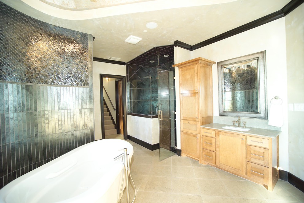 Expansive contemporary bathroom in Dallas with a freestanding tub and an undermount sink.