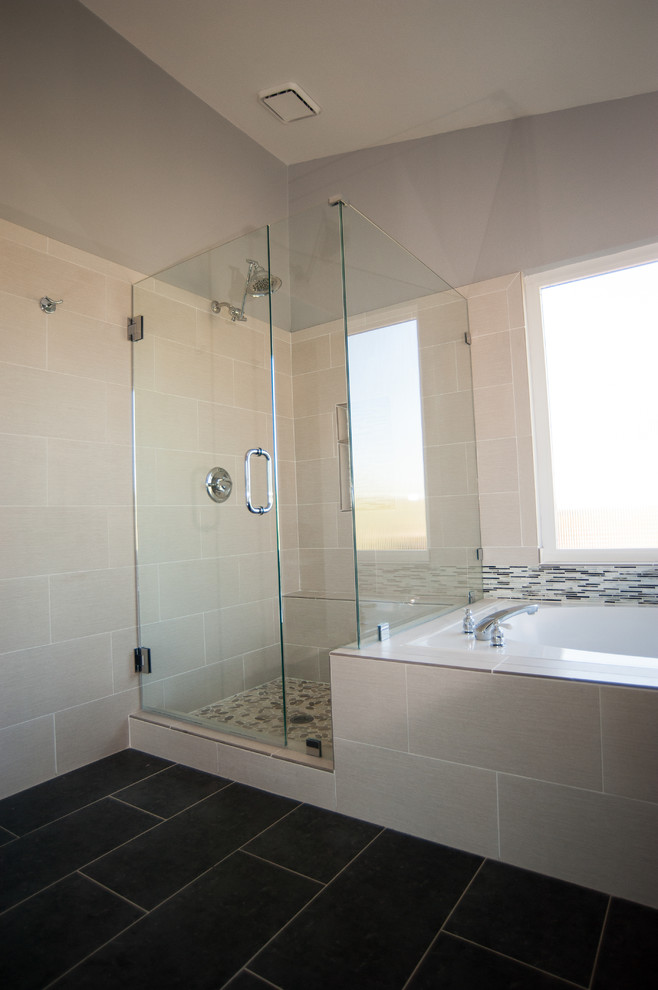 Photo of a large transitional master bathroom in San Diego with flat-panel cabinets, dark wood cabinets, a drop-in tub, a corner shower, a two-piece toilet, black tile, ceramic tile, white walls, ceramic floors, a drop-in sink, quartzite benchtops, black floor, a hinged shower door, white benchtops, a double vanity, a built-in vanity and vaulted.