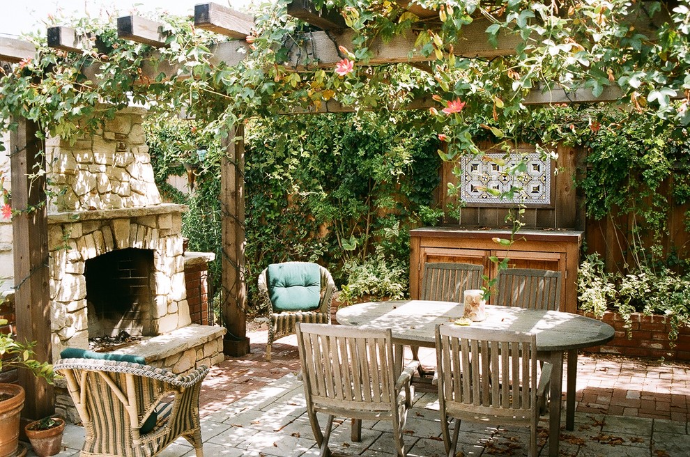 Inspiration for a country patio in San Francisco with a fire feature and a pergola.