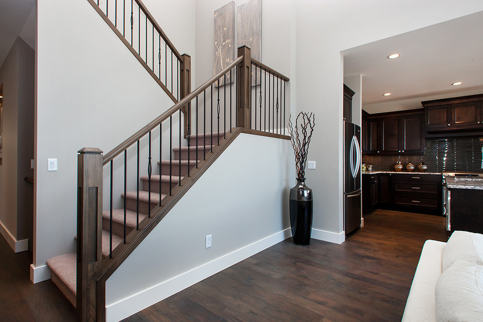 Inspiration for a mid-sized transitional dark wood floor foyer remodel in Vancouver with beige walls