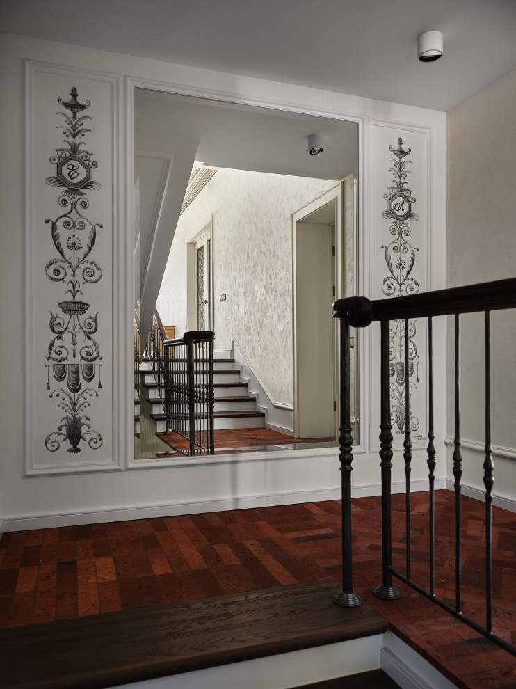 Стильный дизайн: угловая лестница среднего размера в стиле ретро с деревянными ступенями и деревянными перилами - последний тренд