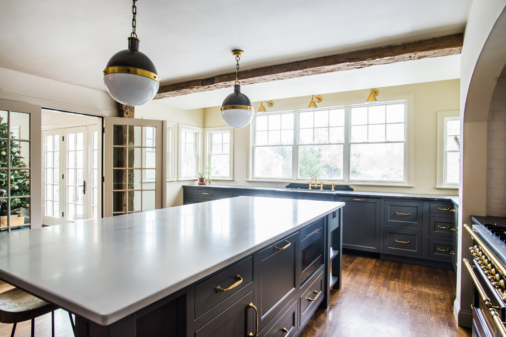 Inspiration for a transitional medium tone wood floor kitchen remodel in Boston with an island