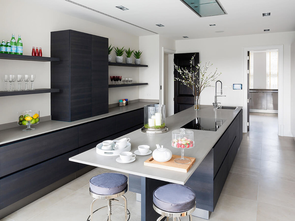 Inspiration for a mid-sized contemporary kitchen in London with a single-bowl sink, flat-panel cabinets, blue cabinets, concrete benchtops, with island and grey floor.