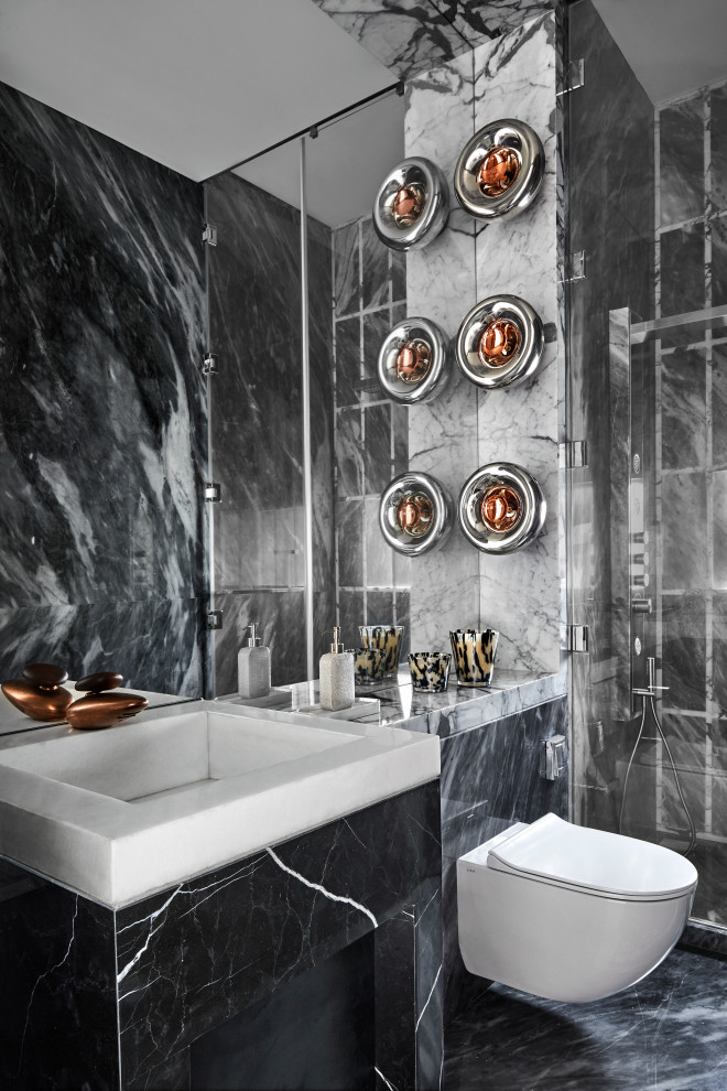 Inspiration for a contemporary bathroom in Mumbai with a wall-mount toilet, gray tile, a console sink, grey floor, white benchtops and a single vanity.