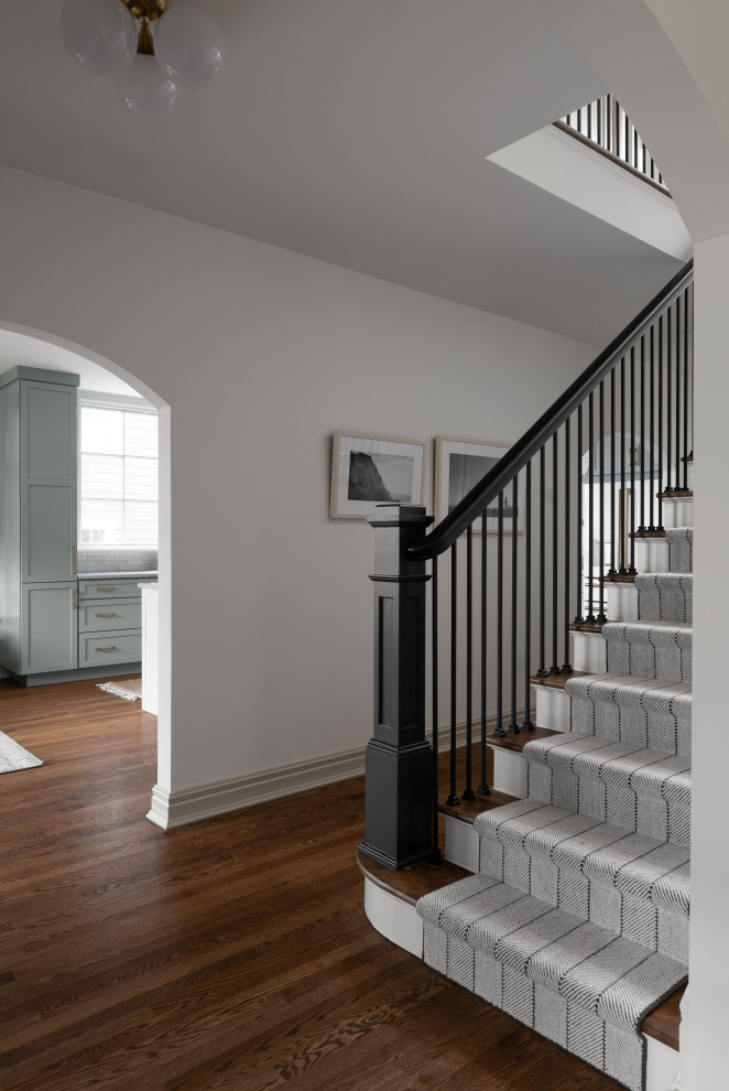Mid-sized modern wood straight staircase in Detroit with painted wood risers and wood railing.