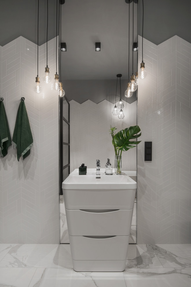 Design ideas for a small industrial powder room in Moscow with flat-panel cabinets, white cabinets, white tile, ceramic tile, white walls, porcelain floors, a drop-in sink, white floor and a freestanding vanity.
