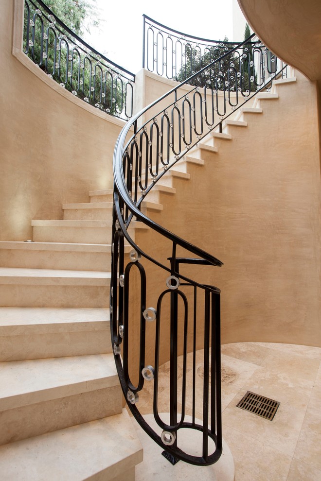 This is an example of a mid-sized mediterranean staircase in Orange County.