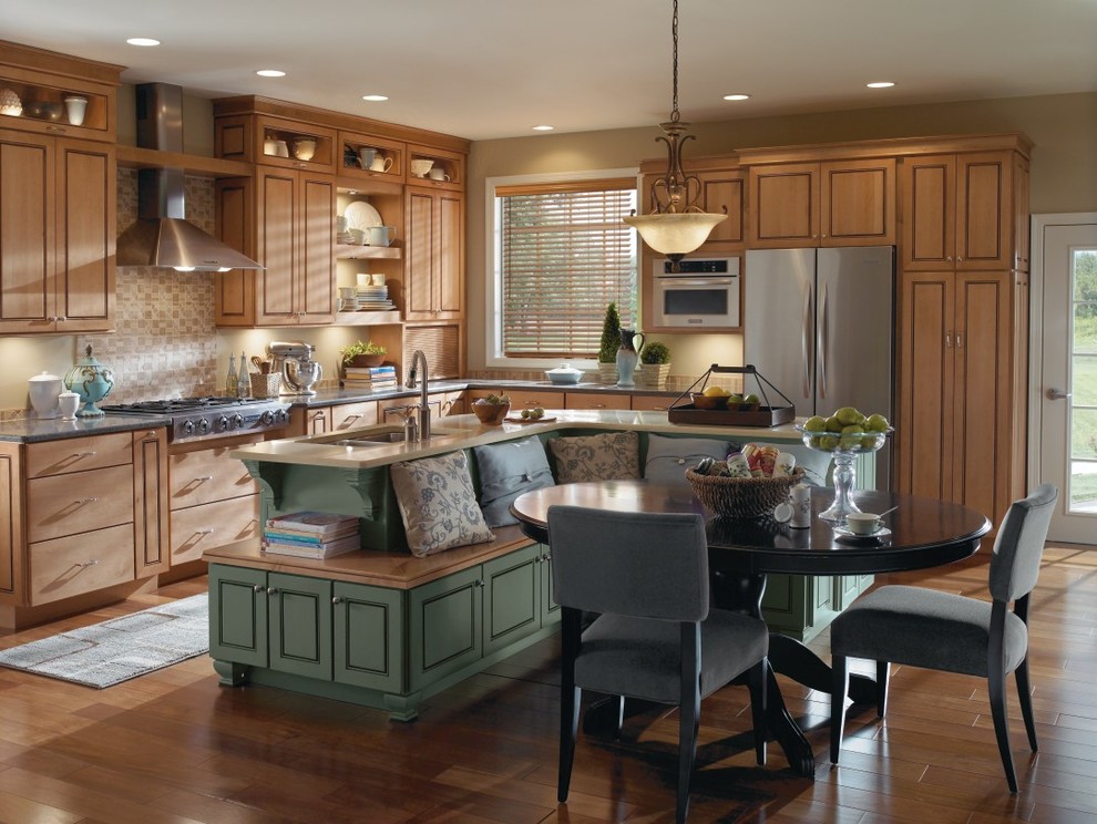 Design ideas for a country l-shaped eat-in kitchen in Other with louvered cabinets, light wood cabinets, beige splashback and stainless steel appliances.