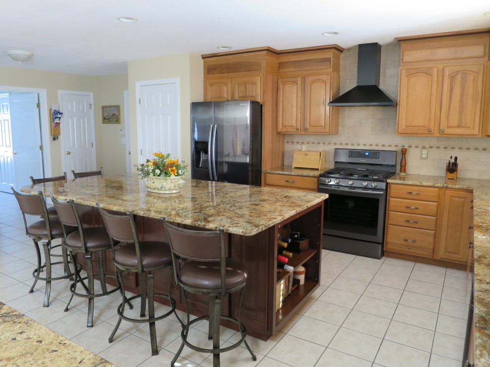 Inspiration for a mid-sized transitional u-shaped ceramic tile and white floor eat-in kitchen remodel in Bridgeport with a double-bowl sink, raised-panel cabinets, light wood cabinets, granite countertops, white backsplash, subway tile backsplash, stainless steel appliances and an island