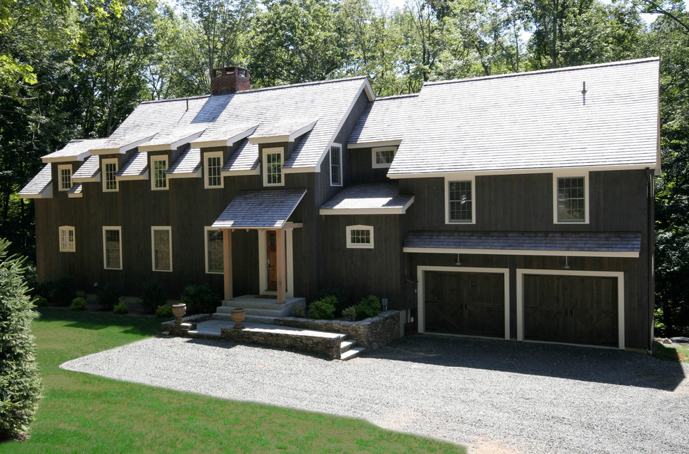 Country two-storey exterior in New York with wood siding.