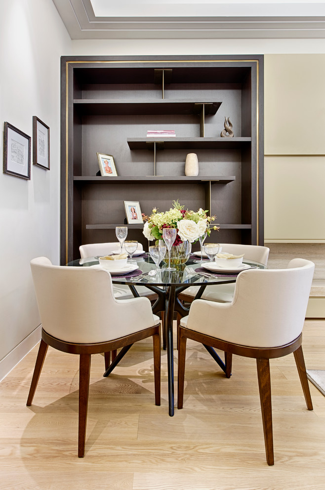 This is an example of a contemporary dining room in Surrey.