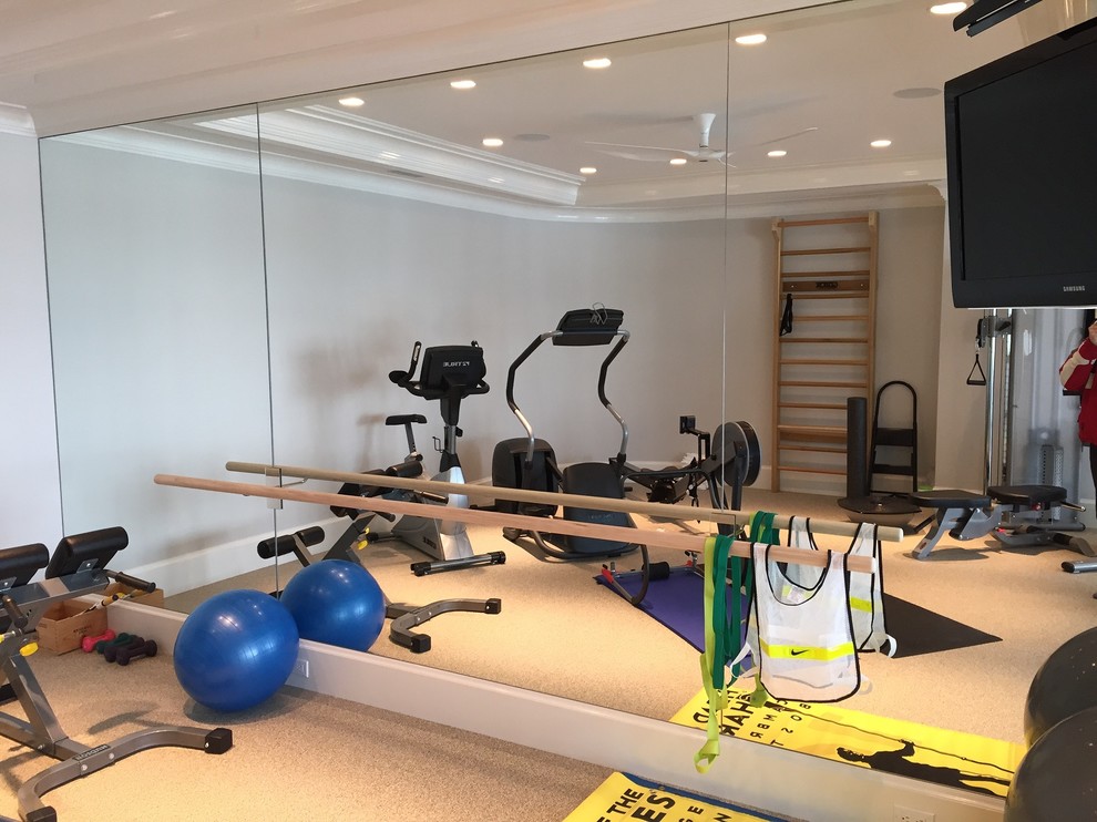 This is an example of a mid-sized traditional home weight room in New York with white walls.