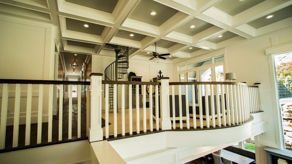 This is an example of a mid-sized beach style staircase in Salt Lake City with wood railing.