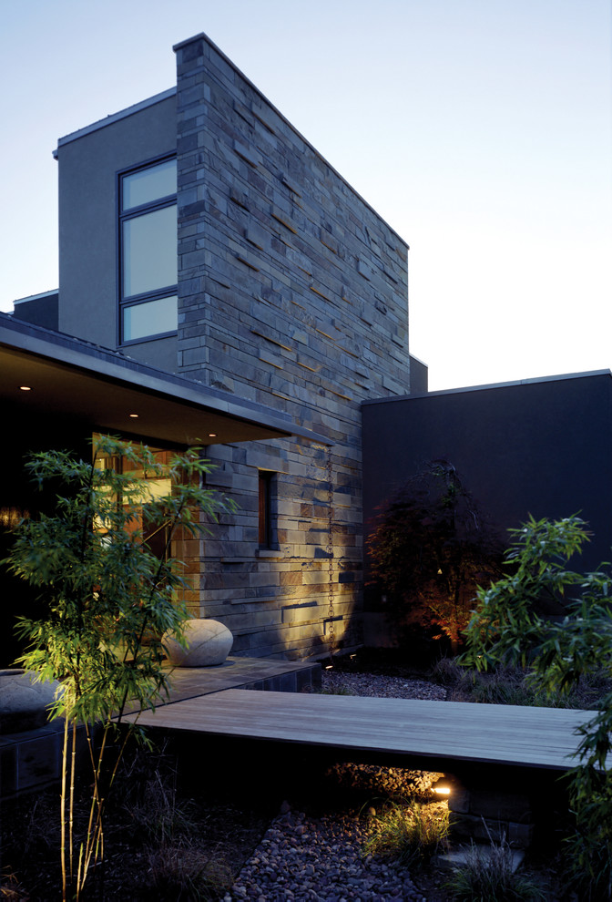 This is an example of a contemporary exterior in Austin with stone veneer.