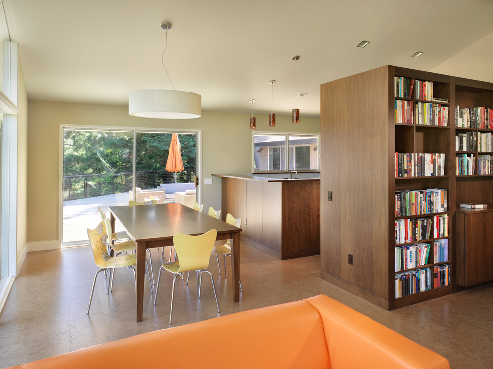 This is an example of a contemporary open plan dining in San Francisco with beige walls.