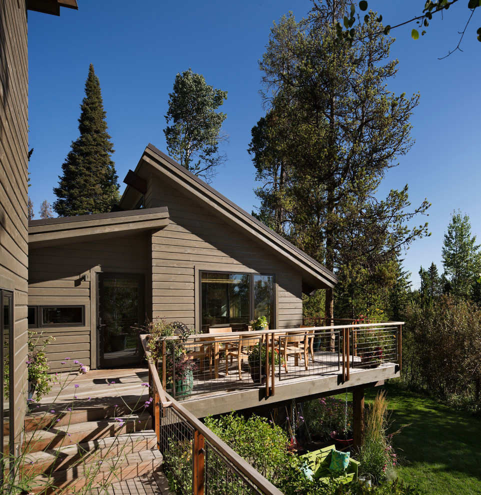 Example of a small mountain style backyard deck container garden design with no cover