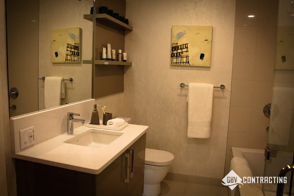 Example of a mid-sized minimalist beige tile bathroom design in Calgary