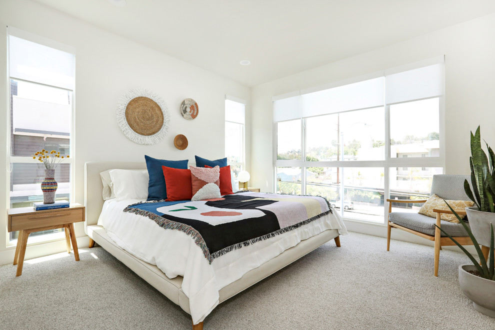 Inspiration for a contemporary master bedroom in Los Angeles with white walls, carpet and grey floor.