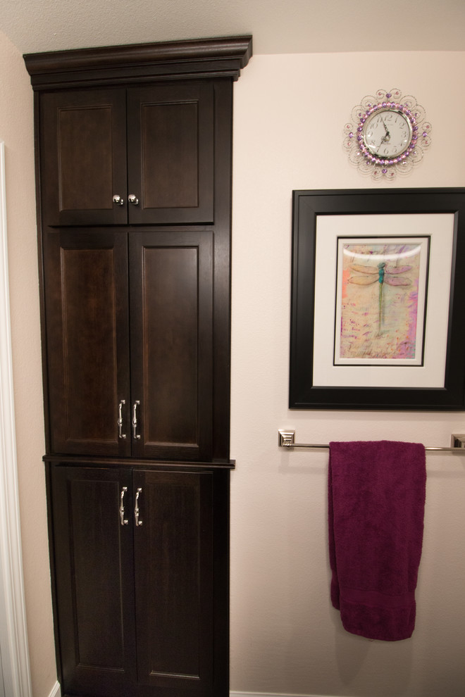Mid-sized transitional master white tile and subway tile brown floor bathroom photo with flat-panel cabinets, dark wood cabinets, a two-piece toilet, pink walls, an undermount sink and quartz countertops