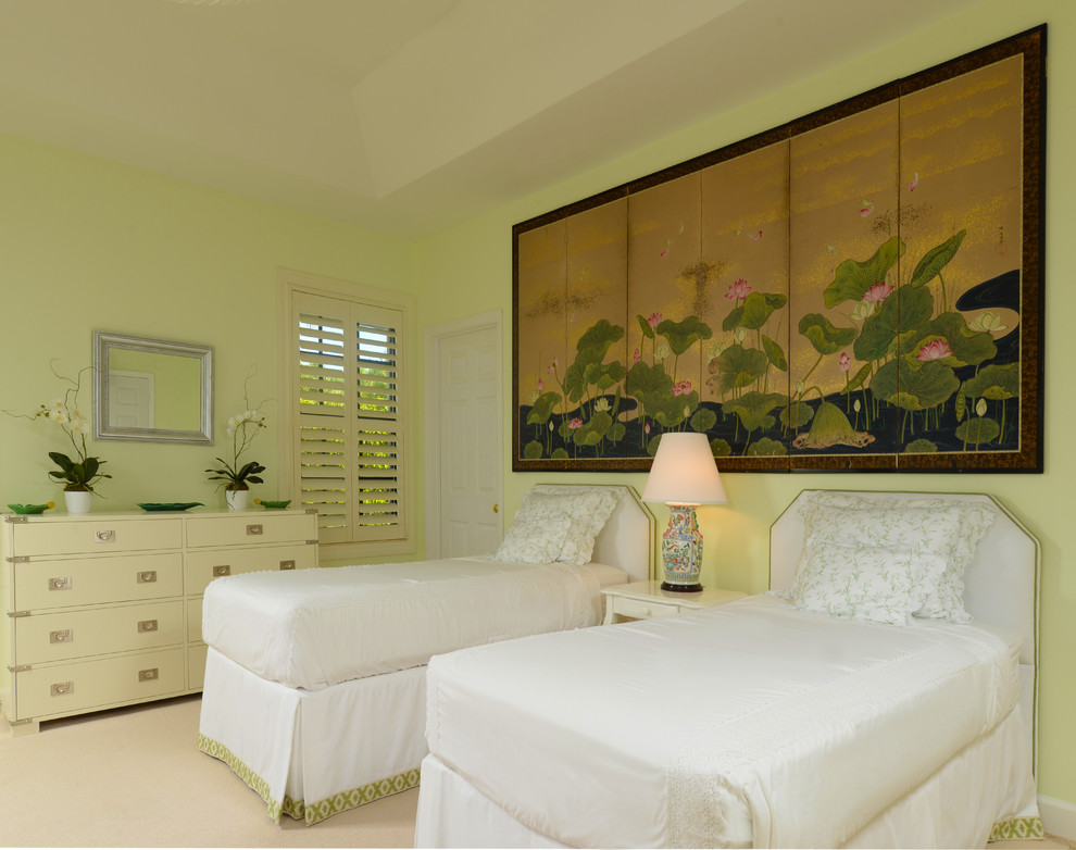 Photo of a mid-sized beach style guest bedroom in New York with green walls and carpet.