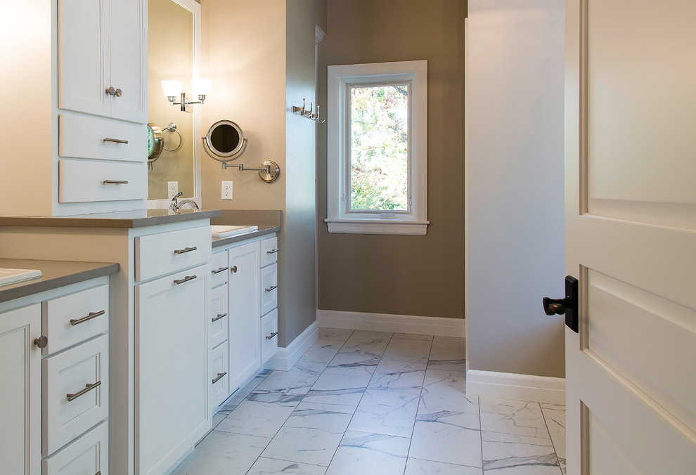 Inspiration for a large rustic master white tile and porcelain tile porcelain tile and white floor bathroom remodel with white cabinets, brown walls, quartzite countertops, shaker cabinets and a drop-in sink