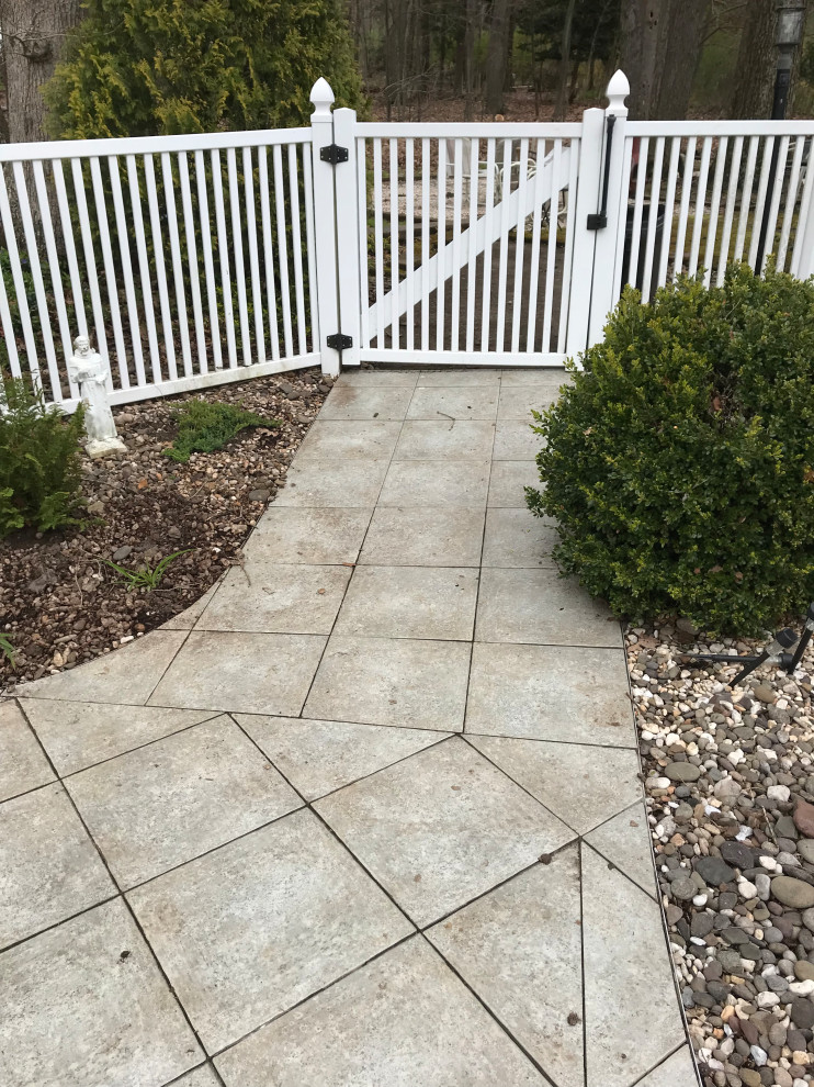 Inspiration for a mid-sized transitional concrete paver pool remodel