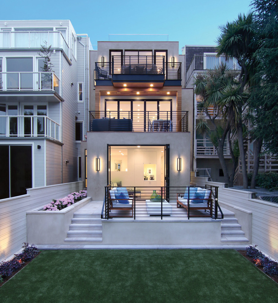Design ideas for a contemporary three-storey stucco grey exterior in San Francisco with a flat roof.