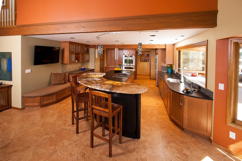 Inspiration for a large rustic u-shaped eat-in kitchen remodel in Boise with a double-bowl sink, glass-front cabinets, light wood cabinets, soapstone countertops, matchstick tile backsplash, stainless steel appliances and two islands