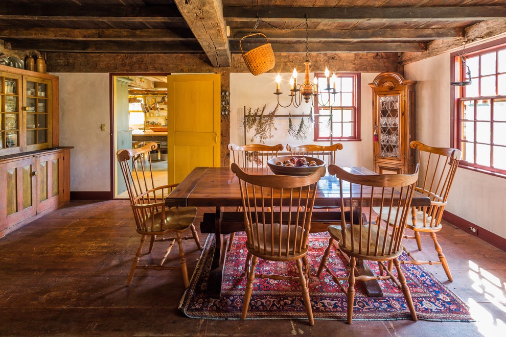 This is an example of a country separate dining room in Boston with beige walls.