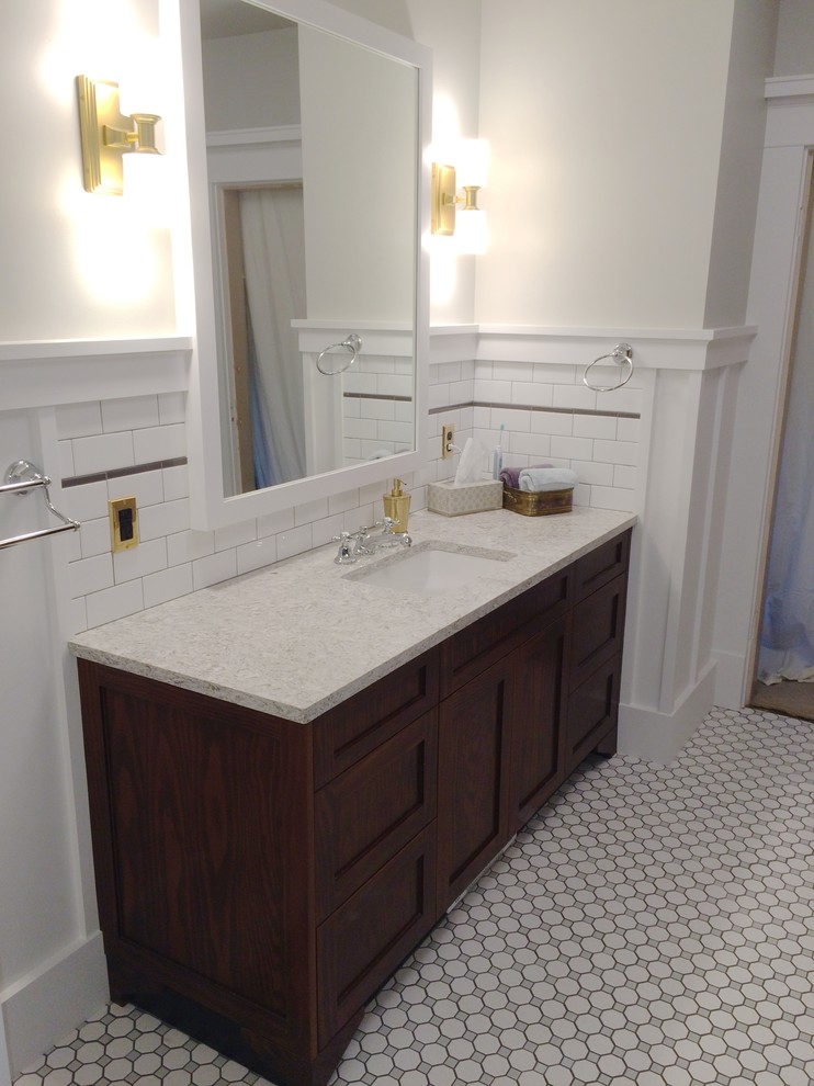 Design ideas for a small traditional bathroom in Seattle with an undermount sink, flat-panel cabinets, dark wood cabinets and white tile.