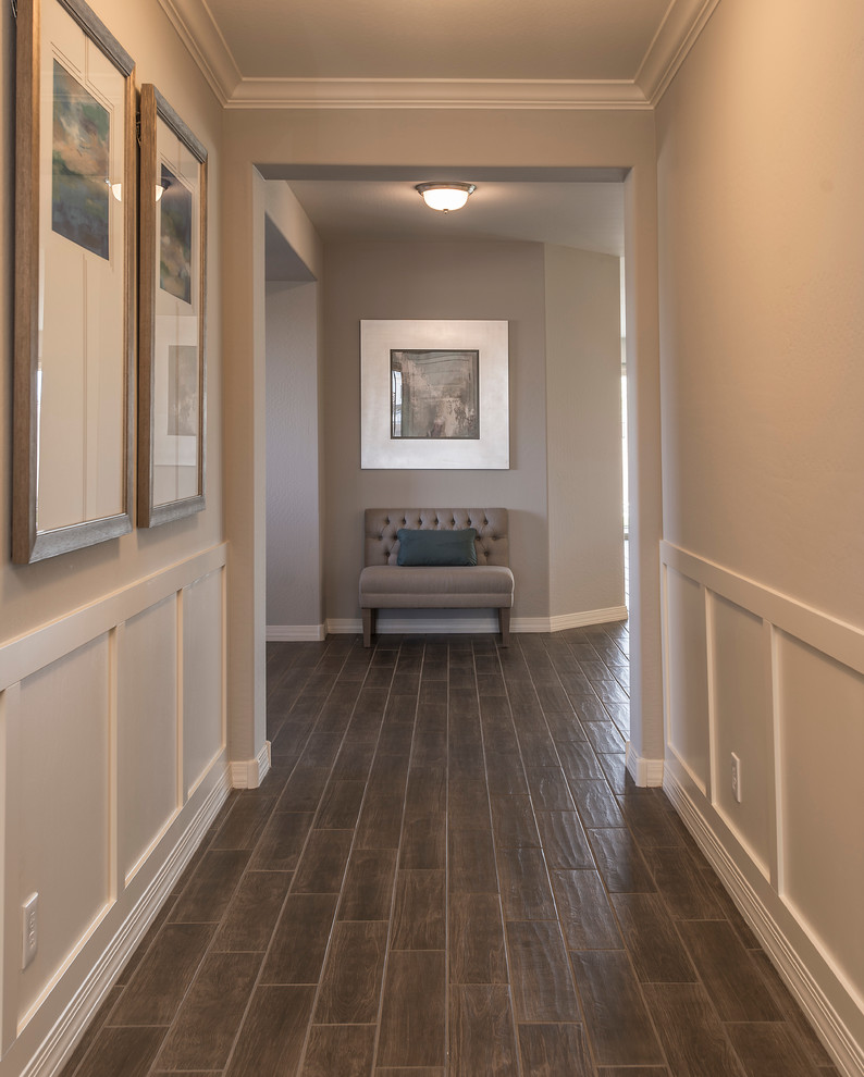 Inspiration for a mid-sized country hallway in Phoenix with beige walls and ceramic floors.