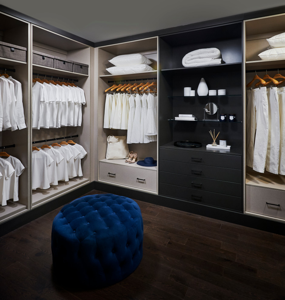 Large transitional gender-neutral dressing room in Toronto with flat-panel cabinets, beige cabinets, dark hardwood floors and brown floor.