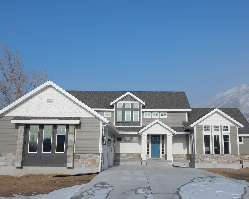 Example of a mid-sized arts and crafts gray two-story concrete fiberboard gable roof design in Salt Lake City