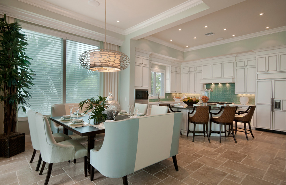 Inspiration for a transitional eat-in kitchen in Miami with white cabinets, panelled appliances and beige floor.