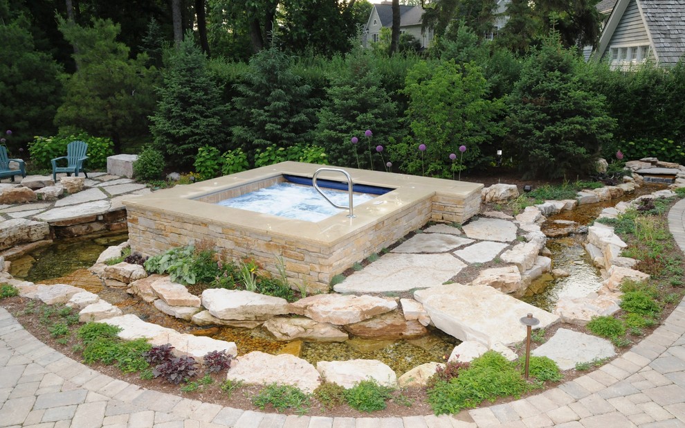 Photo of a small traditional backyard full sun garden in Chicago with natural stone pavers.
