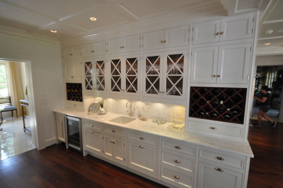 Inspiration for a large traditional l-shaped eat-in kitchen in Dallas with an undermount sink, shaker cabinets, white cabinets, marble benchtops, stainless steel appliances, dark hardwood floors and with island.