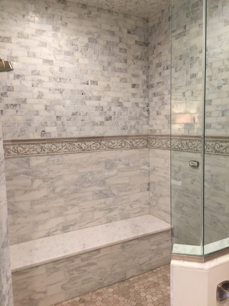 Inspiration for a large traditional master bathroom in Chicago with furniture-like cabinets, grey cabinets, a freestanding tub, a corner shower, a one-piece toilet, white tile, marble, white walls, marble floors, a drop-in sink, quartzite benchtops, grey floor, a hinged shower door and white benchtops.