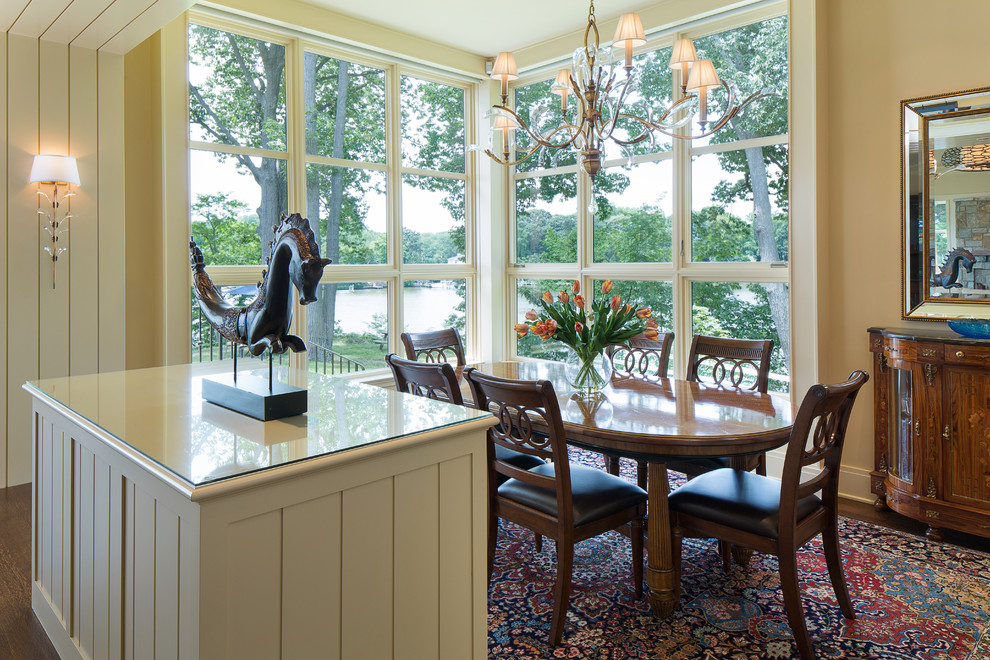 This is an example of a traditional dining room in Baltimore with beige walls.