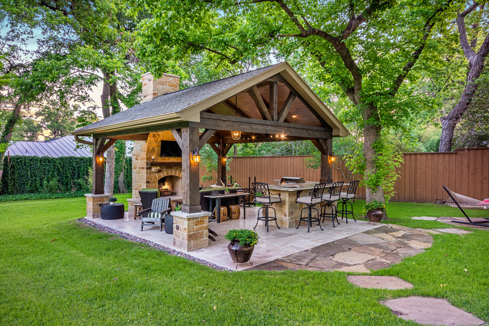 Design ideas for a mid-sized country backyard patio in Houston with an outdoor kitchen, tile and a gazebo/cabana.