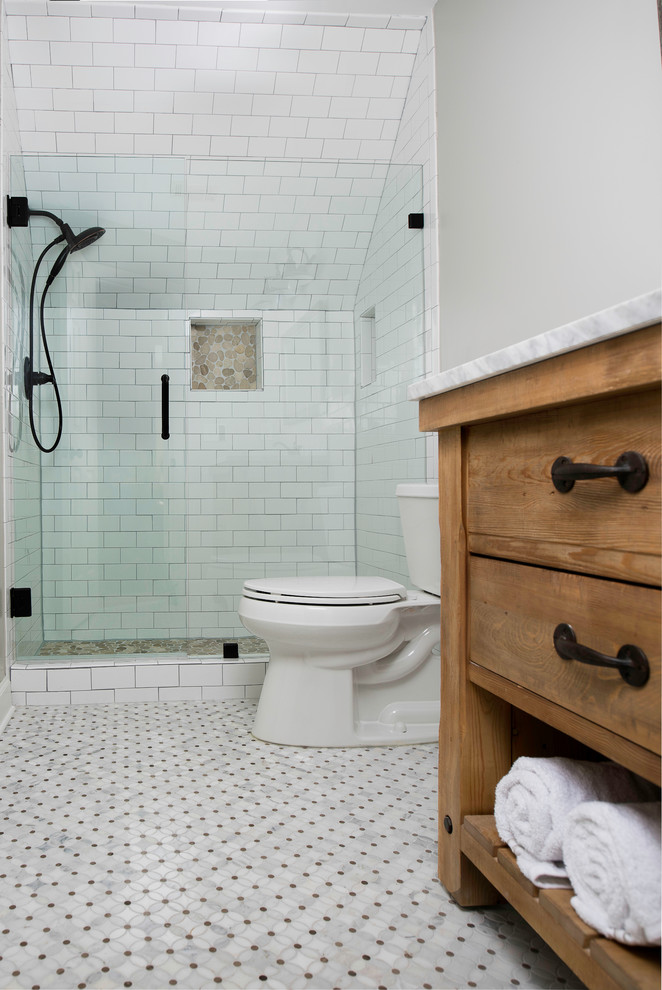 Design ideas for a small country kids bathroom in Atlanta with flat-panel cabinets, light wood cabinets, an alcove shower, a two-piece toilet, white tile, ceramic tile, grey walls, marble floors, an undermount sink, quartzite benchtops, multi-coloured floor and a hinged shower door.
