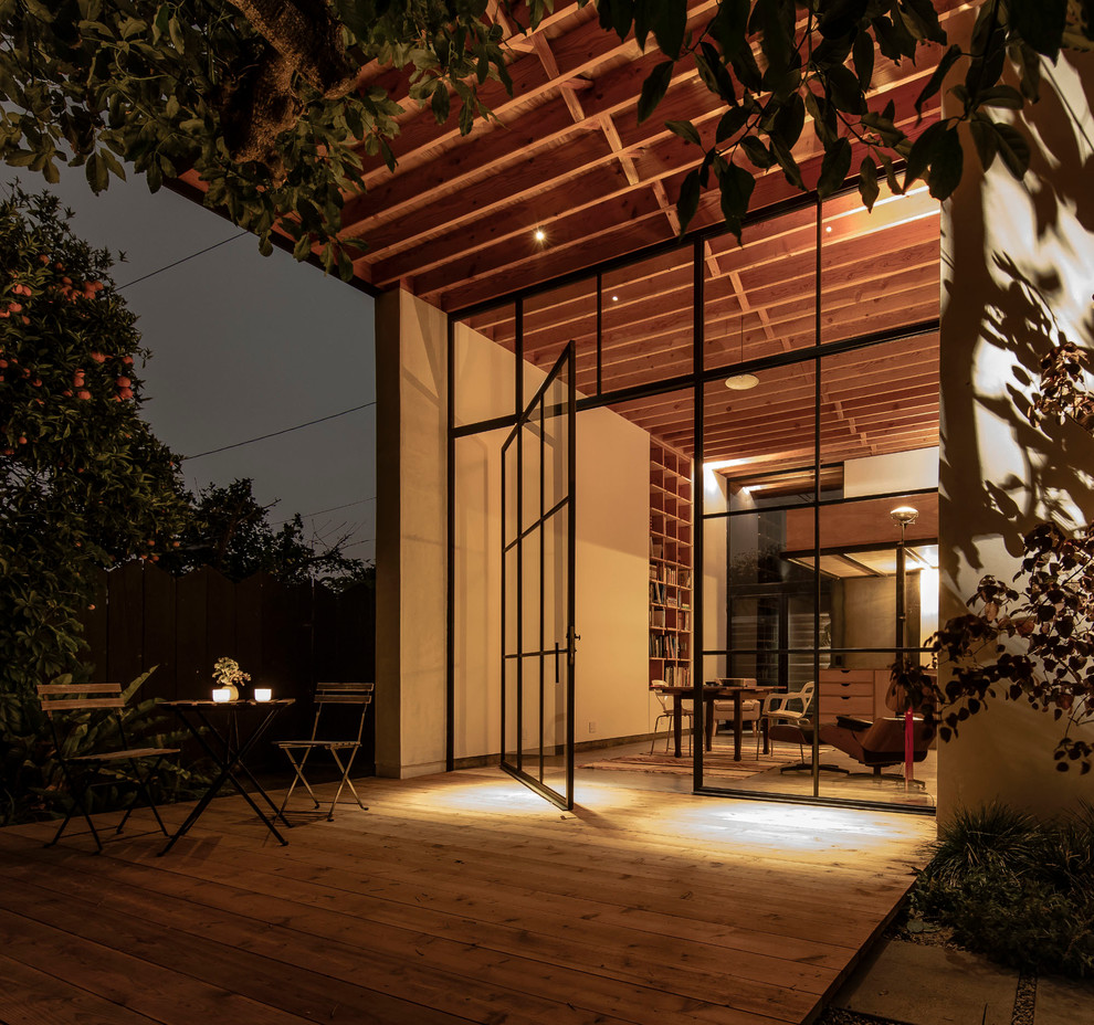 Inspiration for a contemporary concrete floor deck remodel in Los Angeles with white walls